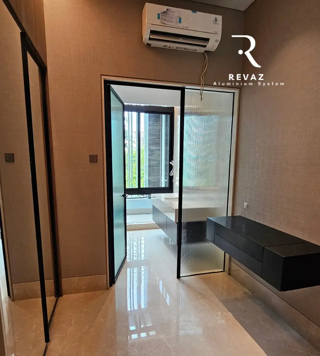 Revaz glass motif swing door project